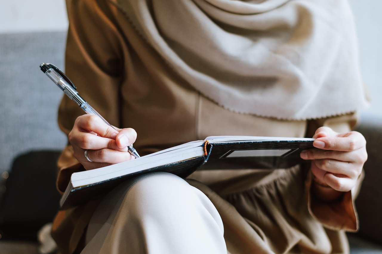 Muslim, woman, writing — "Puerto Rico Tax Incentives: Attracting Investors and Business Owners"